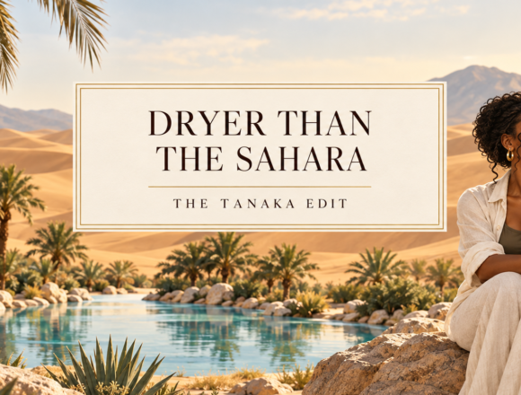 ChatGPT Image Sep 22, 2026, 02_58_24 PM Illustrated feature image for “Dryer Than the Sahara.” A woman sits thoughtfully beside an oasis amid golden desert dunes, beneath the article title.
